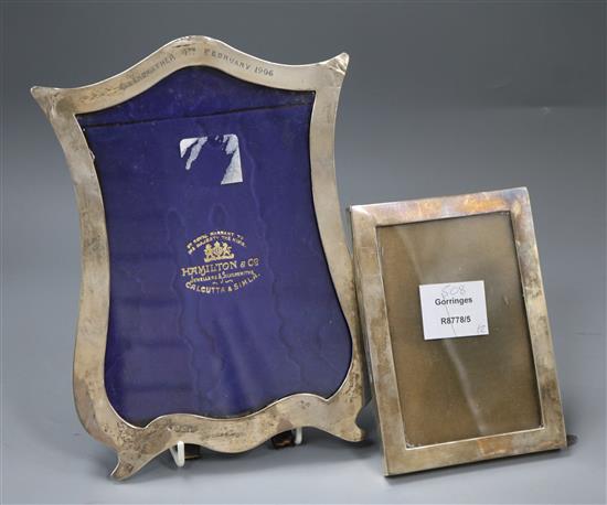 An Edwardian shaped silver mounted photograph frame and other silver mounted photograph frame, 24cm.